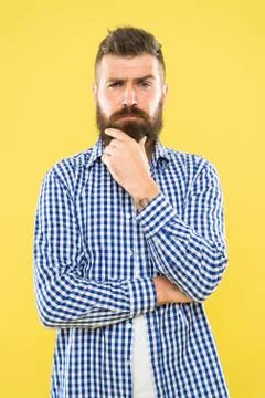 Needing a barber to shape the beard. Bearded man thinking of visiting barber Stock Photos