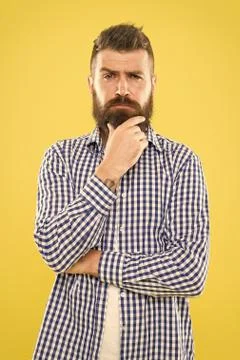 Needing a barber to shape the beard. Bearded man thinking of visiting barber Stock Photos