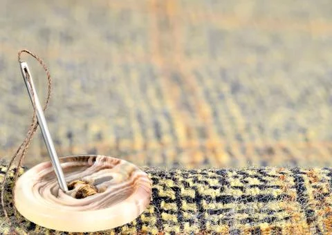 Needle and button Stock Photos