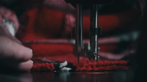 Needle and Foot of the Sewing Machine Penetrate the Fabric Close-up Stock Footage 229490912