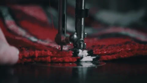 Needle and Foot of the Sewing Machine Penetrate the Fabric Close-up Stock Footage 229491295