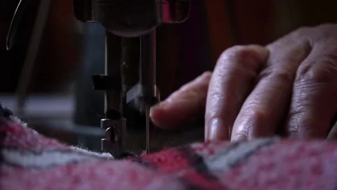 Needle and Foot of the Sewing Machine Penetrate the Fabric Close-up Stock Footage 229491477