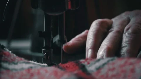 Needle and Foot of the Sewing Machine Penetrate the Fabric Close-up Stock Footage 229635558