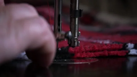 Needle and Foot of the Sewing Machine Penetrate the Fabric Close-up Stock Footage 229965125