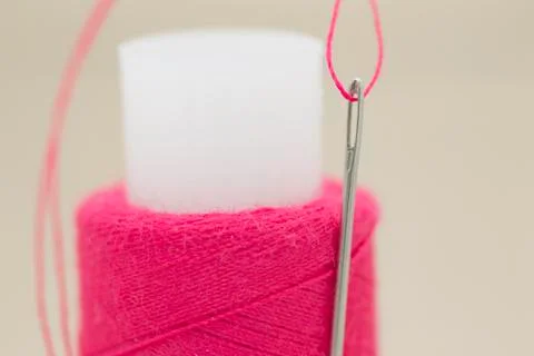 A needle and spool of thread Stock Photos