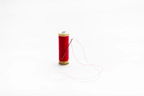 Needle and thread are all we need to sew or mend something. Stock Photos