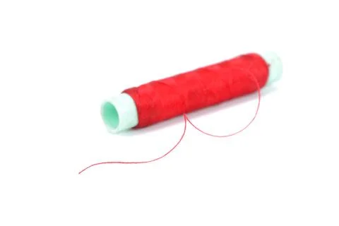 Needle and thread isolated over white background Stock Photos