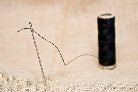 Needle and thread. Stock Photos