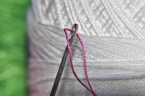 Needle and thread Stock Photos