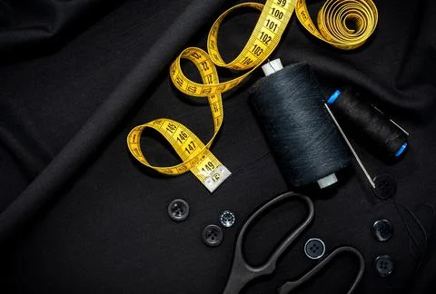 Needle and thread. Scissors and a centimeter are the tools of a tailor Stock Photos