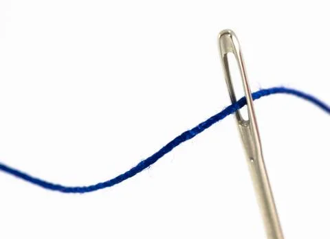 Needle and thread on white background Stock Photos