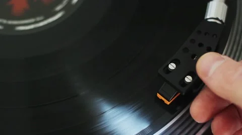 Needle being put on vinyl record player Stock Footage 43735357