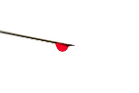 Needle with blood macro Stock Photos
