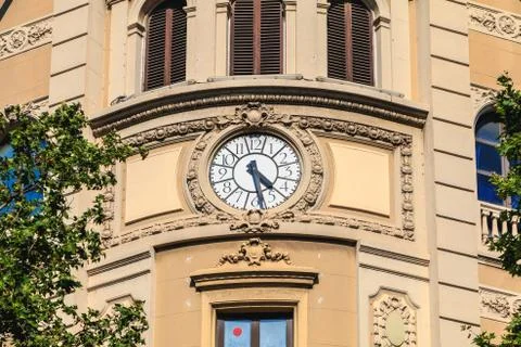 Needle clock on a wall the wall of a building Stock Photos
