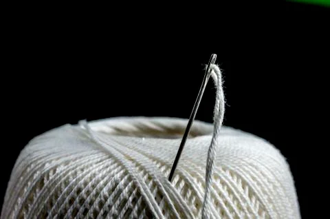 Needle on cotton thread Stock Photos