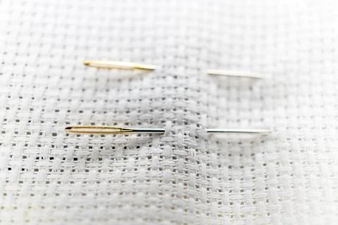 Needle on embroidery canvas Foto stock