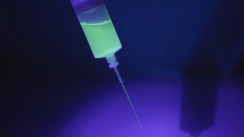 Needle with Fluorescent Liquid Stock Footage 234210778