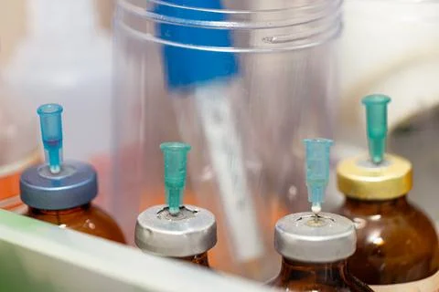 Needle Inserting Medicine into Bottle Stock Photos