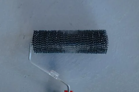 Needle roller for bubbles in the epoxy floor Stock-Fotos