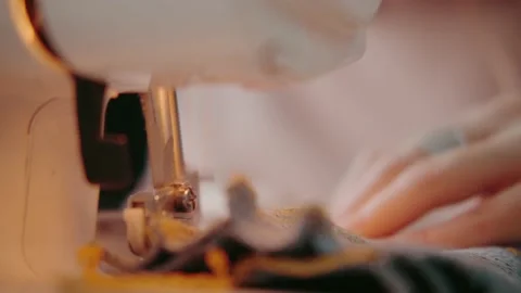 The needle of the sewing machine moves quickly, close-up Video stock 143690808