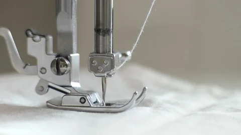 The needle of the sewing machine stands still, and then begins to sew Stock Footage 129421552