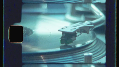 Needle On Spinning Turntable Record Player Vintage 8mm Film 4K Scan Stock Footage 133723732