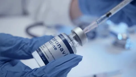 Needle Syringe getting ready for injection for vaccination a doctor takes a Stock-Footage 336587110