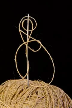 Needle with thread isolated Stock Photos