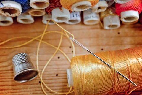 Needle with thread Stock Photos