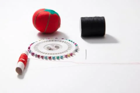 Needle, thread, push pins and cushion Stock Photos