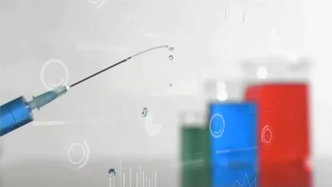 Needle tip forming droplet and ejecting stream arcing toward blurred vials for Stock Footage 323274492