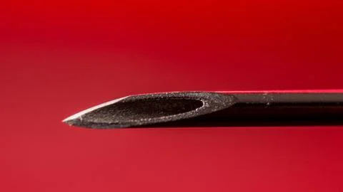 Needle tip of an injection syringe, macro shot Stock Photos