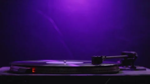 Needle on turntable playing record with retro lighting, concept of nostalgi.. Stock Footage 310723803