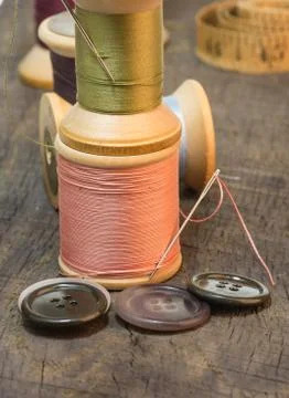 Needles and sewing thread with buttons Stock Photos