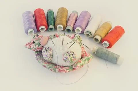 Needles and threads. Stock Photos