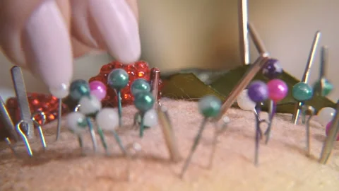 Needles. The hand takes the needle Stock Footage 99899435