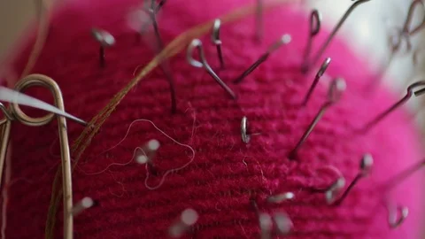 Needles in a pincushion close up Video stock 128419518