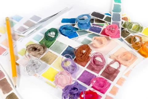Needlework. embroidery. match colors of thread. Stock Photos