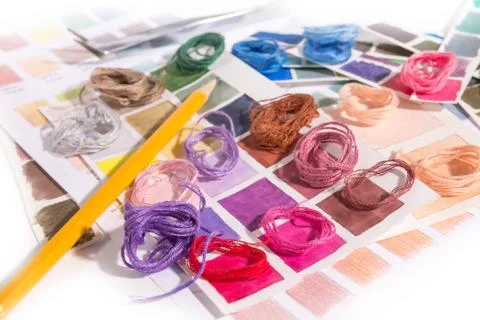Needlework. embroidery. match colors of thread. Stock Photos