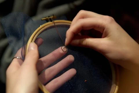 Needlework hands on the Hoop Stock Photos