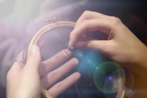 Needlework hands on the Hoop Stock Photos