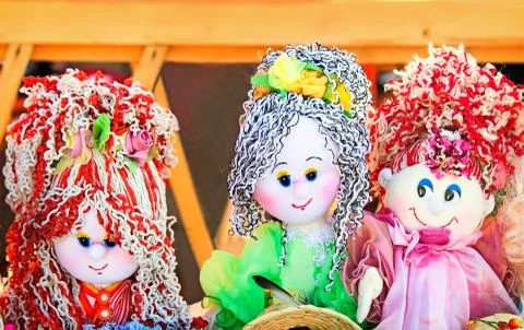 Needlework, original toys in the form of amusing dolls Stock Photos