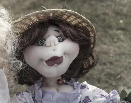 Needlework, original toys in the form of amusing dolls Stock Photos