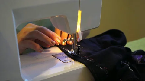 Needlework. Sewing on a typewriter, mending. Stock Footage 128247823