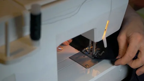 Needlework. Sewing on a typewriter, mending. Video stock 128247918