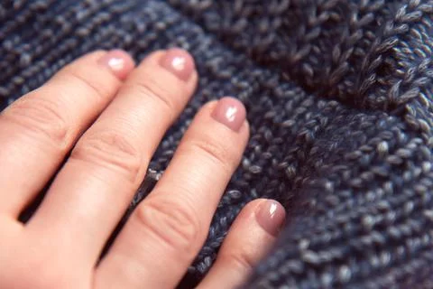 Needlework. Texture beautiful knitted blue fabric as background Stock Photos