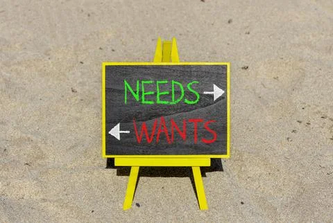 Needs instead wants words symbol. Concept words Needs Wants on beautiful ye.. 스톡 사진