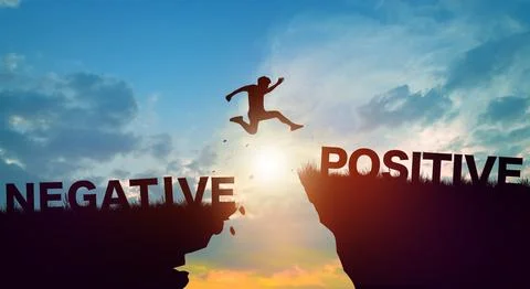 Negative and Positive wording on cliffs with sunrise. Positive Thinking Con.. Stock Photos