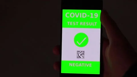 Negative corona test smartphone video indoors Stock Footage 147605342