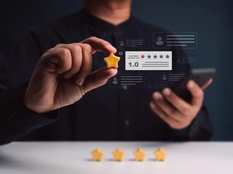 Negative customer feedback concept with low rating review and warning icon... Stock Photos